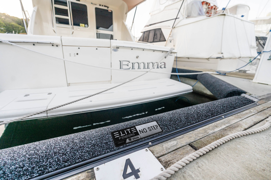 ELITE dock bumpers protecting a boat in its marina slip