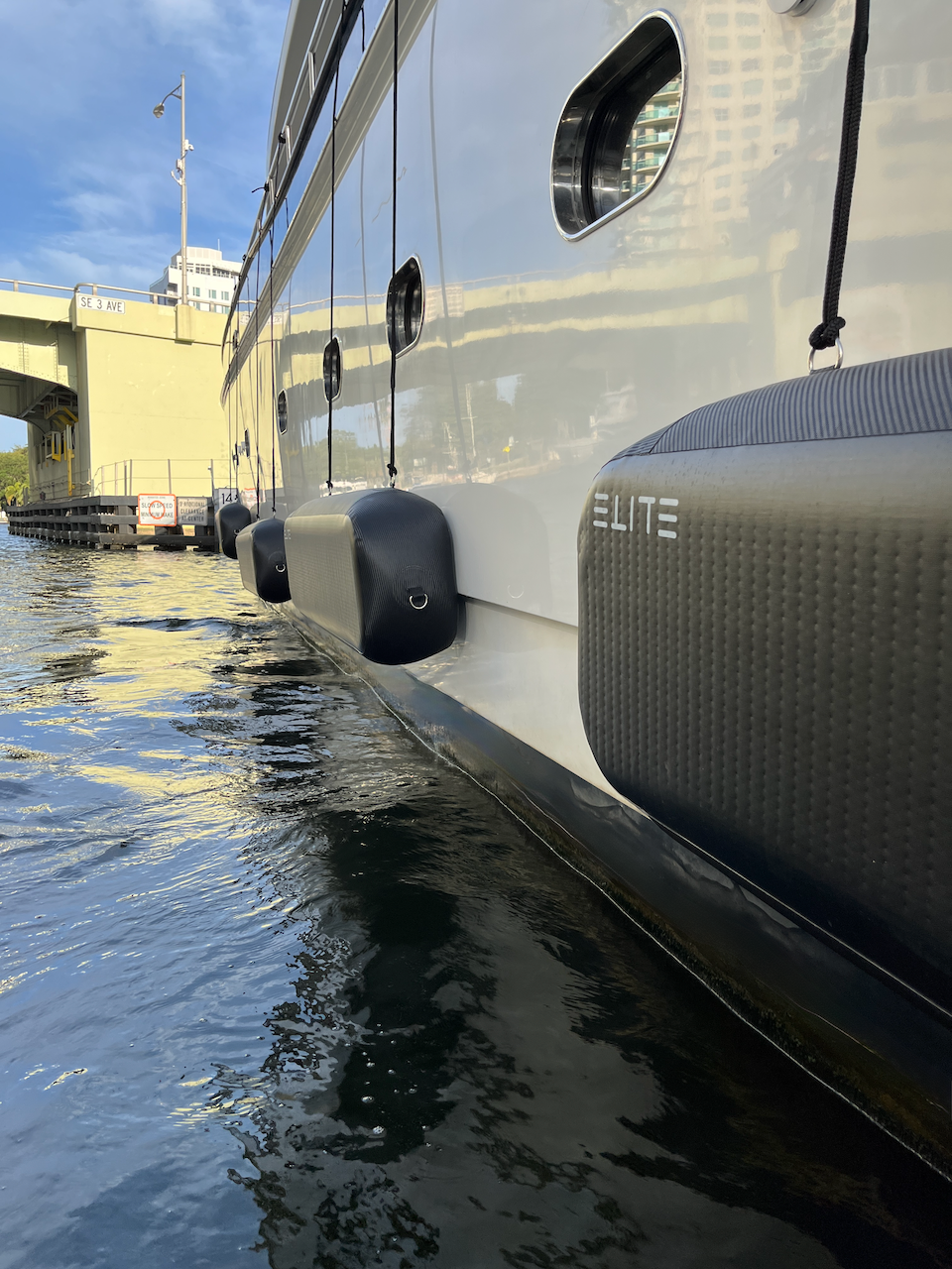 ELITE flat fenders protecting a yacht alongside a dock